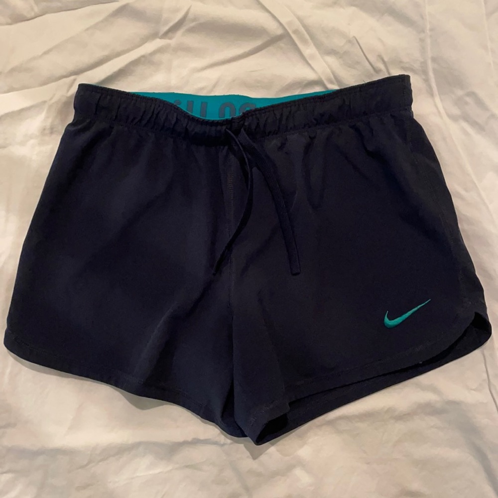 Dark blue/teal Nike shorts with built in spandex